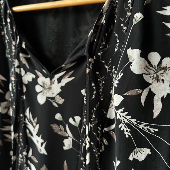 black floral peplum top with tassel ties. - Picture 2 of 2